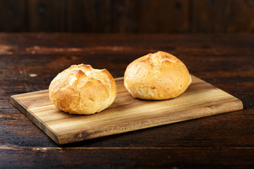 wheat buns on a wooden background