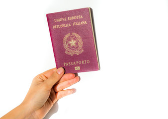 Woman's hand holding an Italian passport isolated - European Union