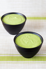 cream broccoli soup in a black plate