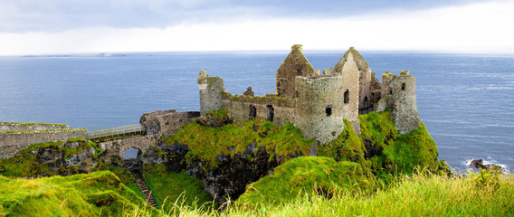 Dunluce castle in Northern Ireland, United Kingdom. Causeway coastal driving tourist route on the Emerald Island. 