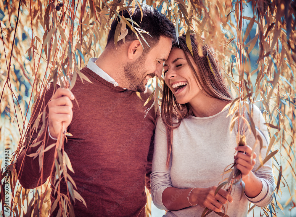 Wall mural Young couple in love outdoor