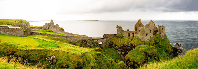 Dunluce castle in Northern Ireland, United Kingdom. Causeway coastal driving tourist route on the Emerald Island. 