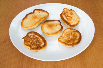 Traditional Polish dish racuchy on white plate.