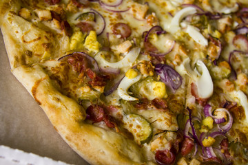 closeup of vegetable pizza in a box