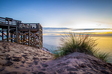 Summer Sunset Over Lake. Massive sand dunes and scenic overlook on Lake Michigan within the Sleeping Bear Dunes National Lakeshore on the Pierce Stocking Scenic Drive in Michigan.