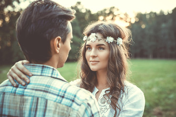 Fototapeta premium Young lovely couple at sunset