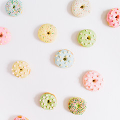 Colorful donuts. Flat lay, top view minimal pattern.