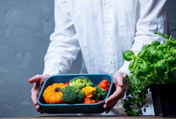 Caucasian woman cooking vegetables for a dinner
