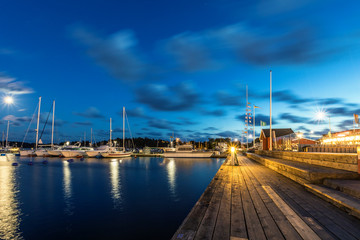 Fototapeta na wymiar Sailing boats and yachts in marina at night. Nynashamn. Sweden.