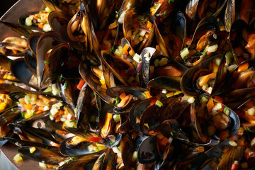 Fresh seafood cocktail with mussels and chopped vegetables