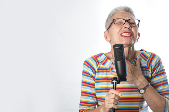 Senior Elderly Woman Singing Karaoke, Expressing Her Music Spirit, Having Fun, White Background