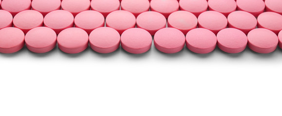 Color round pills on white background