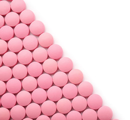 Color round pills on white background