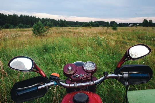 First-person view from an old motorcycle in the field