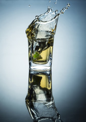 shots of wine falling from lemon