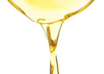 Pouring cooking oil on white background, closeup