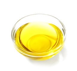 Glass bowl with cooking oil on white background
