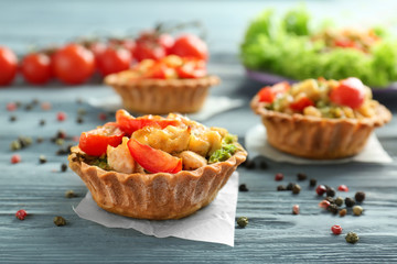 Delicious crispy tart with broccoli on table