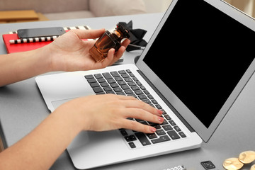 Woman working with laptop at table