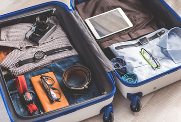 Open suitcase full of clothes