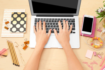 Fototapeta premium Woman working with laptop at table