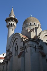 Fototapeta na wymiar Old mosque against clear blue sky, concept of Islam inspiring beauty and peace