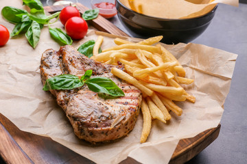 Delicious grilled steak frites on waxed paper