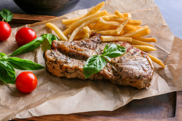 Delicious grilled steak frites on waxed paper