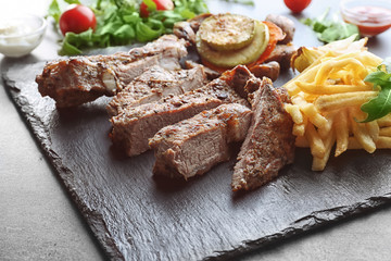 Delicious grilled steak frites on slate plate