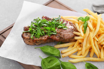 Delicious grilled steak frites on waxed paper