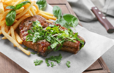 Delicious grilled steak frites on waxed paper