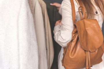 Woman choosing article of clothing