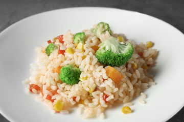 Plate with rice pilaf and broccoli, closeup