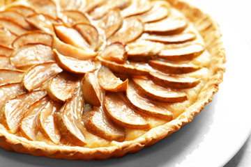 Plate with tasty pear tart, closeup