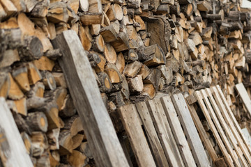 A pile of stacked firewood. Preparation for winter season. Ukraine