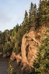 Sunrise famous Hopewell Rocks geologigal formations at low tide biggest tidal wave Fundy Bay New...
