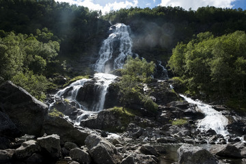 Huge waterfall in Norway on sunny day