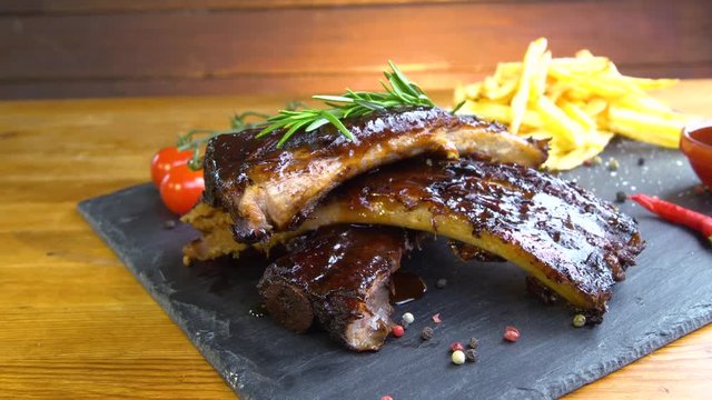 grilled bbq ribs on stone plate