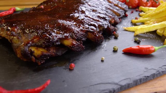 grilled bbq ribs on stone plate