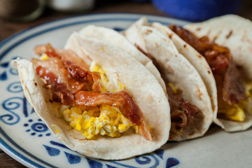 Crispy glazed bacon and fried eggs breakfast tacos