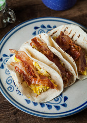 Crispy glazed bacon and fried eggs breakfast tacos