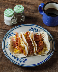 Crispy glazed bacon and fried eggs breakfast tacos