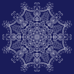 openwork monochrome white mandala on dark blue background