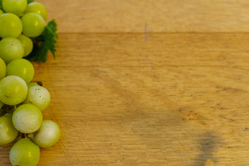 background old oak barrel with grapes