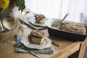 dinner for the family. yellow flowers on the table. table near the window
