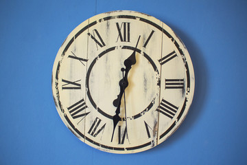 wall clock on a blue background