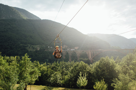 Woman riding on zip line