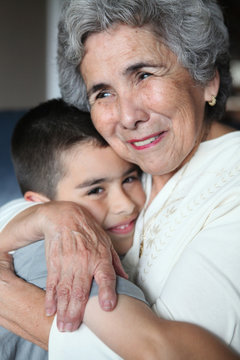 Hispanic Grandma Hugging Grandson