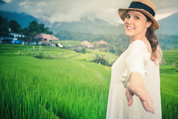 Happy woman traveling in jatiluwih rice terrace, Bali, Indonesia.