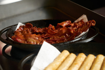 Cooked delicious breakfast bacon and sausage